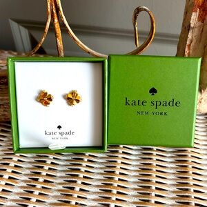 Kate Spade Spade Flower stud earrings in a gold tone finish.